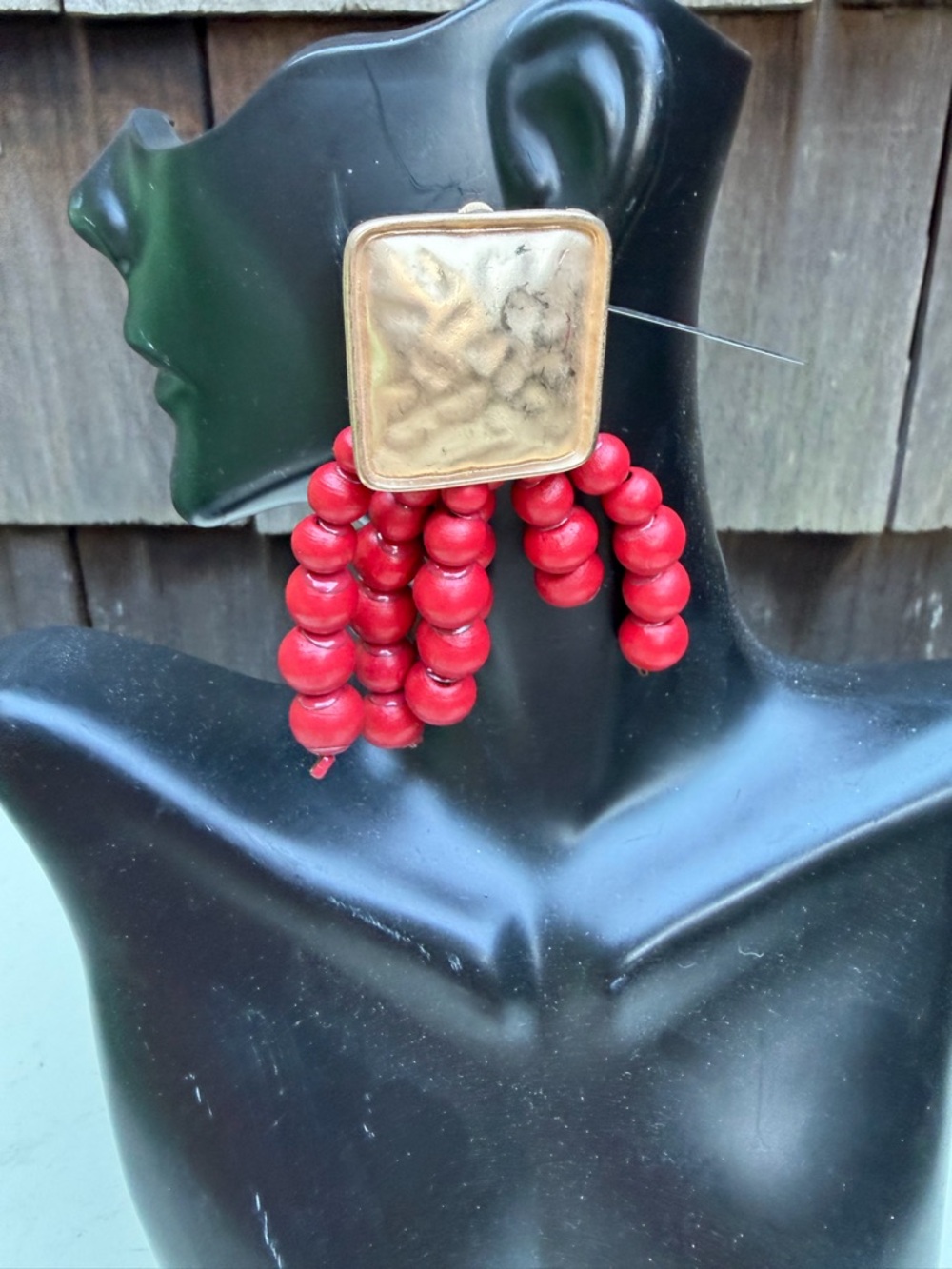 Bold statement dangle earrings gold tone with red wood beads clip on. Size 3”